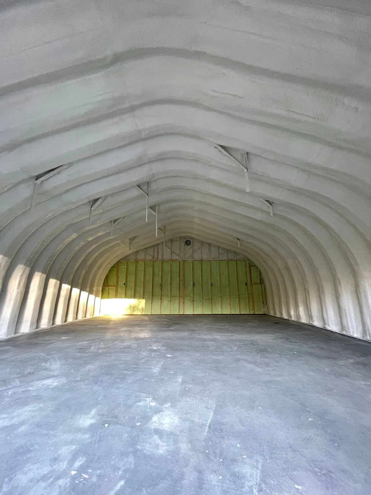 Large Quonset sprayed from the walls to the crown