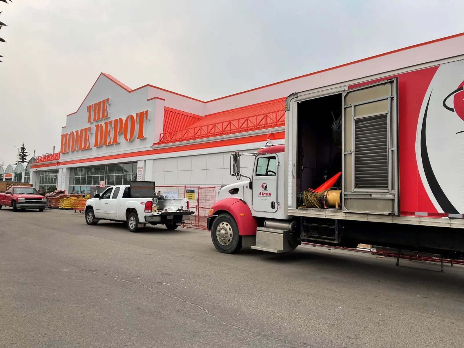 Aires spray rig and trailer at a large commercial job